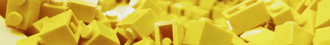 Close-up of yellow LEGO bricks piled together in a horizontal banner image